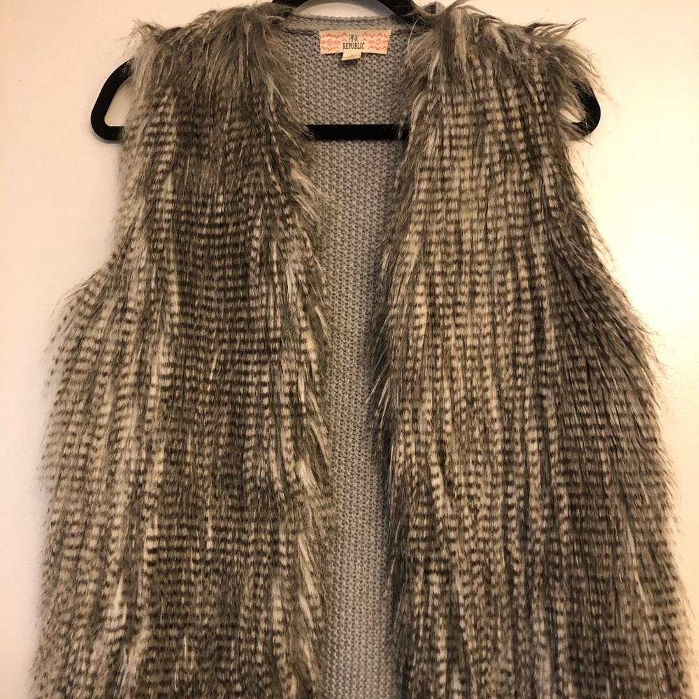 Gray, and white soft shaggy faux fur vest.